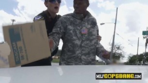 Sexy busty cops bust a fake soldier on the street and they have interracial sex with him.