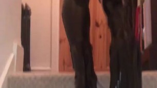 Black shiny latex leggings and black high heeled boots