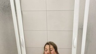 Marlene Miller squatting on black dildo in shower with anal plug