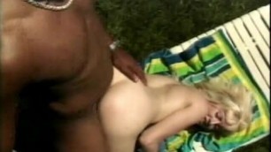 Gorgeous blonde loves huge black dick in her ass from behind outdoors